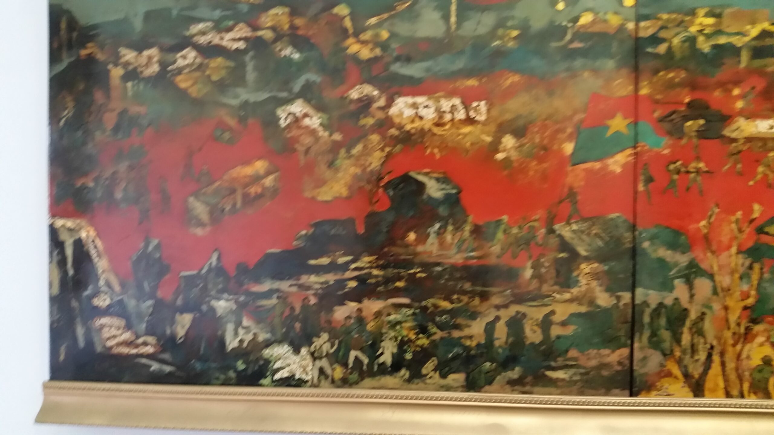 Abstract painting with vibrant red and green.