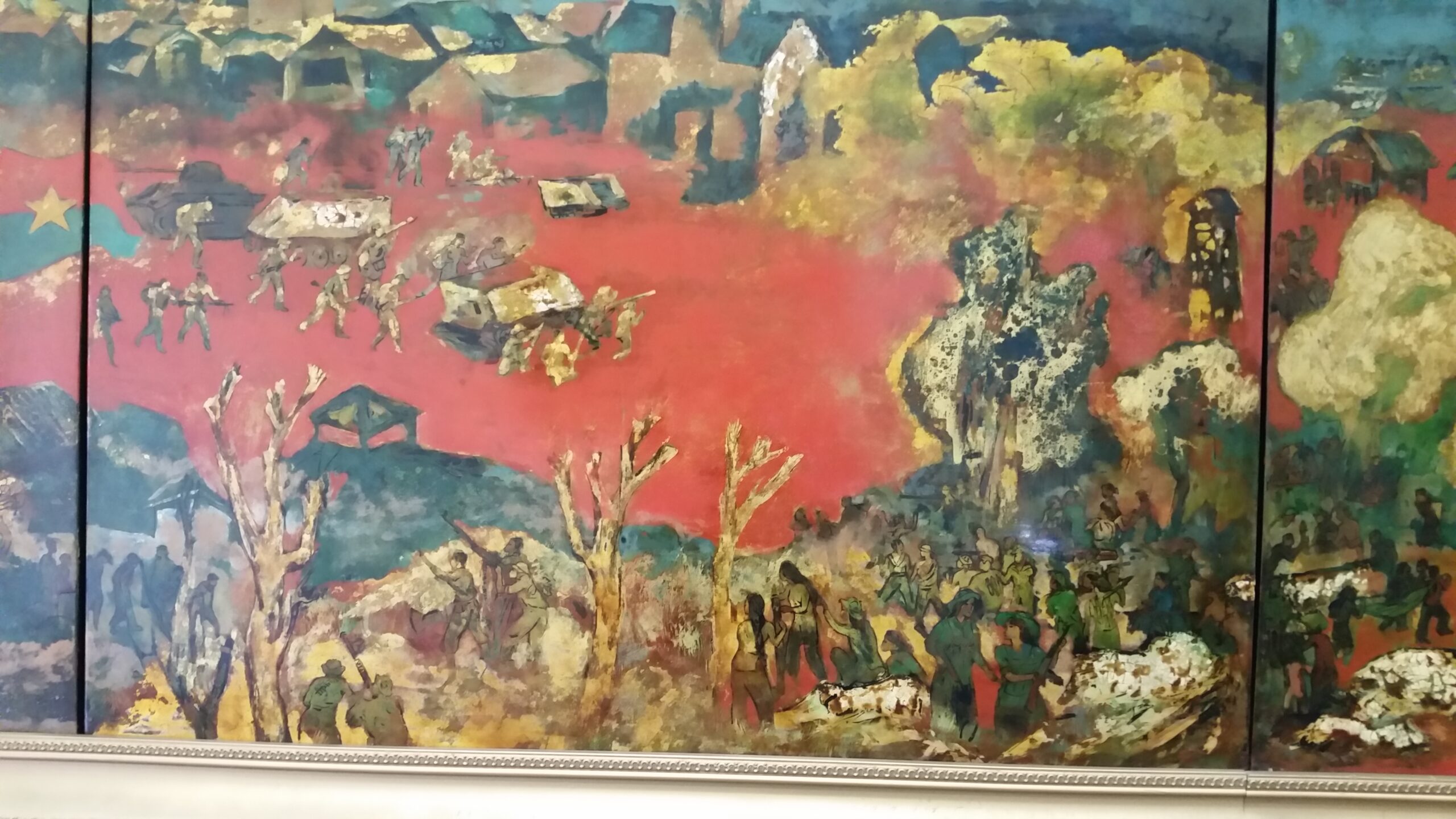 Colorful abstract landscape with figures and buildings.