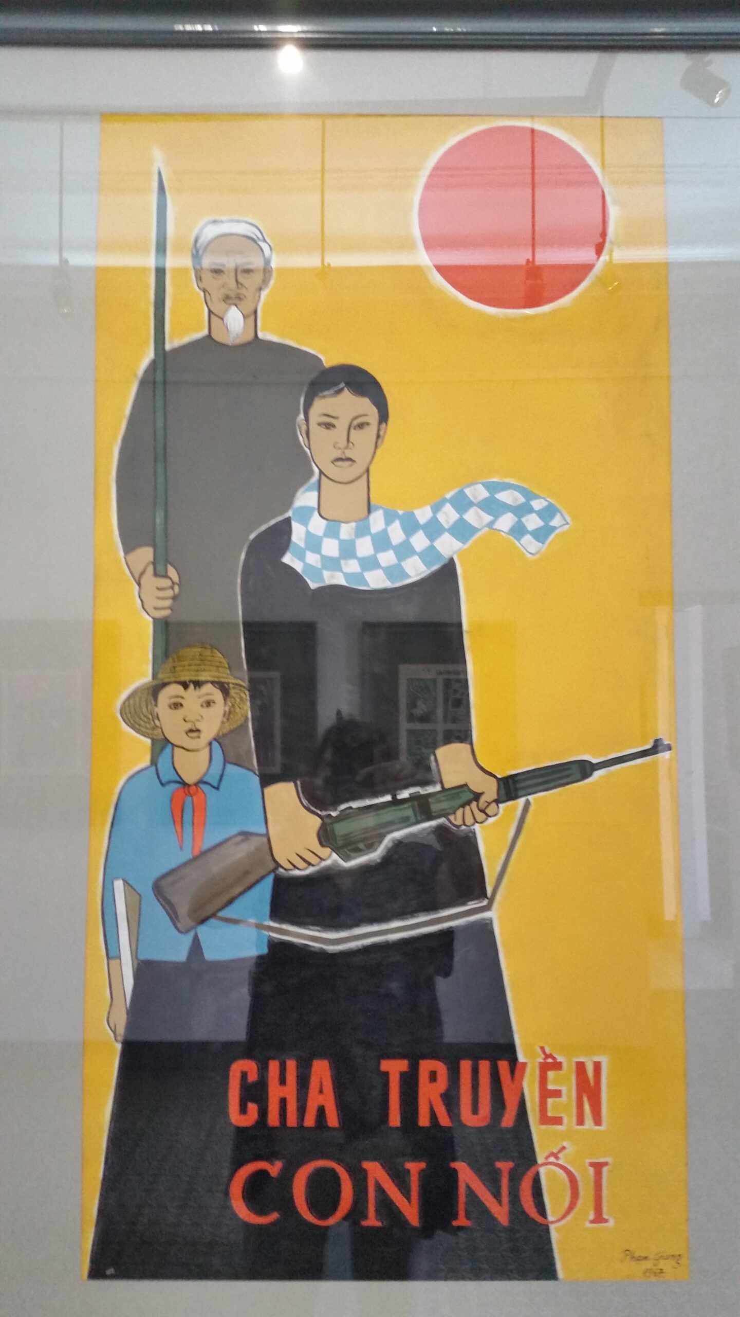 Vietnamese propaganda poster with three figures.