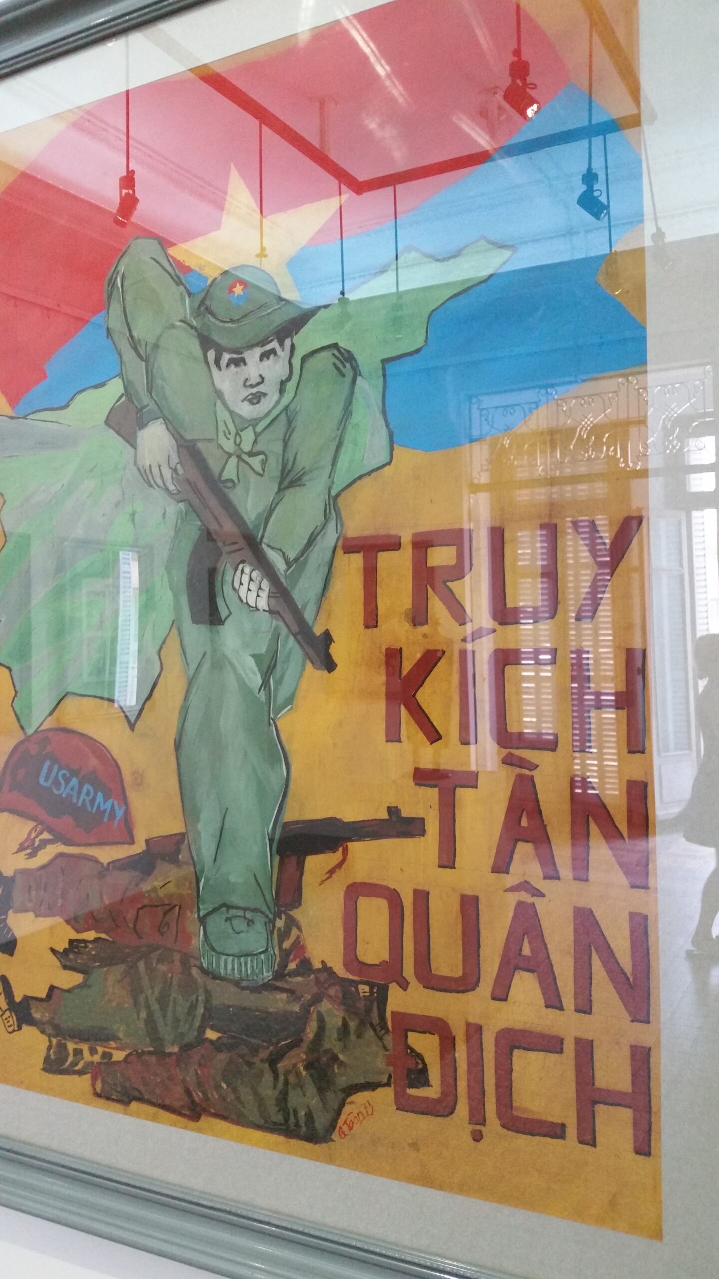 Soldier with rifle on colorful propaganda poster.