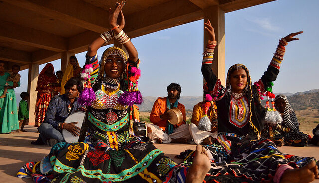Traditional dancers performing in colorful attire.